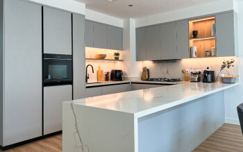 Modern Grey Kitchen with Waterfall Island
